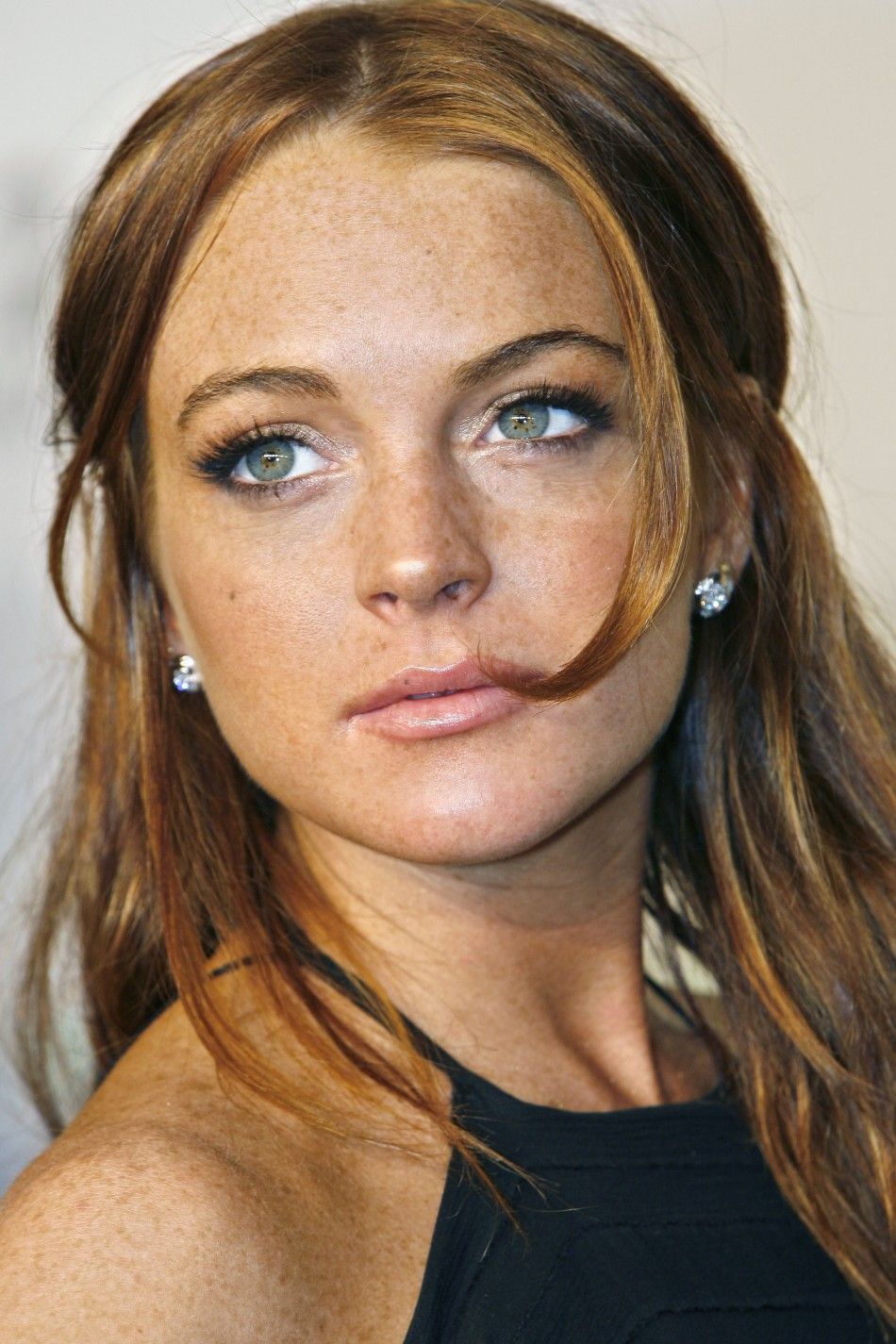 Singer actress Lohan poses for photographers on red carpet at 2006 CFDA Fashion Awards in New York City