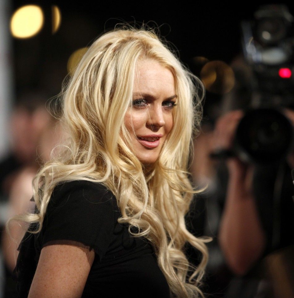Actress Lohan is interviewed as she arrives at Sir Richard Branson and Eve Bransons Rock the Kasbah Gala in Los Angeles
