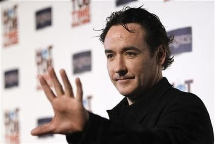 Cast member John Cusack waves at the premiere of &#039;&#039;Hot Tub Time Machine&#039;&#039; in Hollywood, California