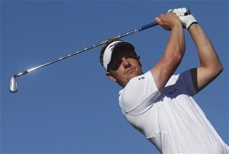 Luke Donald of Britain chips to the 16th green during the fourth round of the Madrid Masters golf tournament in Alcala de Henares near Madrid