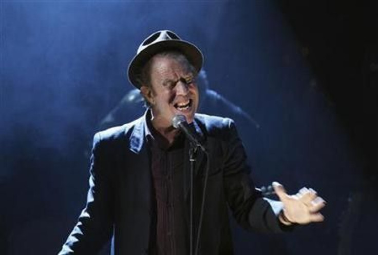 Singer Tom Waits performs after being inducted at the 2011 Rock and Roll Hall of Fame induction ceremony at the Waldorf Astoria Hotel in New York