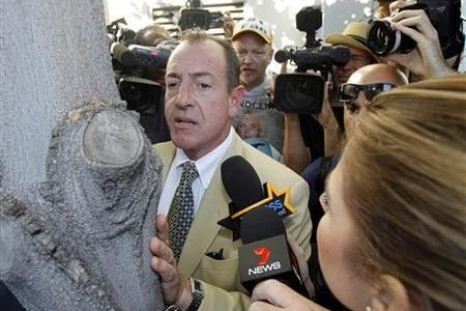 Michael Lohan waits outside the Beverly Hills Courthouse after his daughter Lindsay was denied bail and sent to jail in Beverly Hills, California