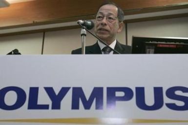 Olympus Corp President Kikukawa speaks during a news conference in Tokyo