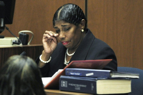 Cherilyn Lee wipes her eyes during testimony during the Dr. Conrad Murray involuntary manslaughter trial in Los Angeles