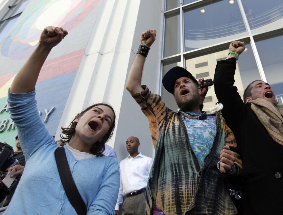 People yell out during an anti-Wall Street protest in Oakland