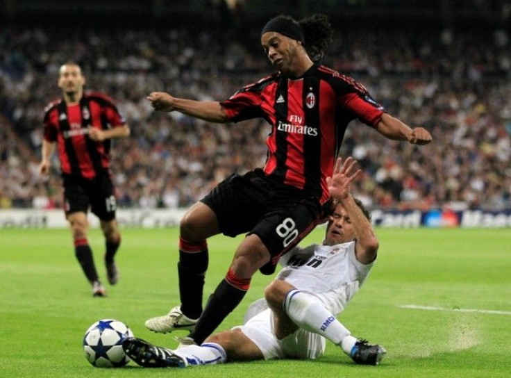 AC Milan's Ronaldinho is challenged by Real Madrid's Carvalho during their Champions League Group G soccer match in Madrid 