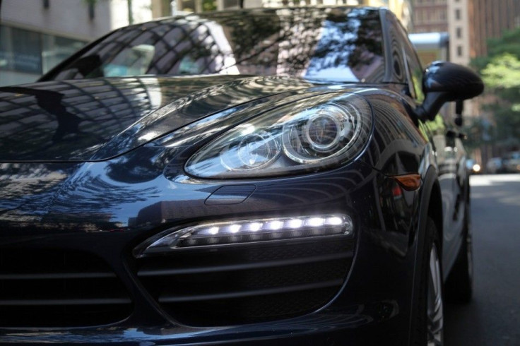 The 2012 Porsche Cayenne S&#039; headlights.