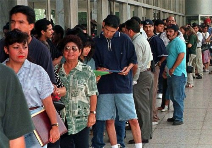 A group of immigrants, who qualify for residency in the United States but do not yet have their legal papers, stand in line at the Immigration and Naturalization Service offices in Los Angeles