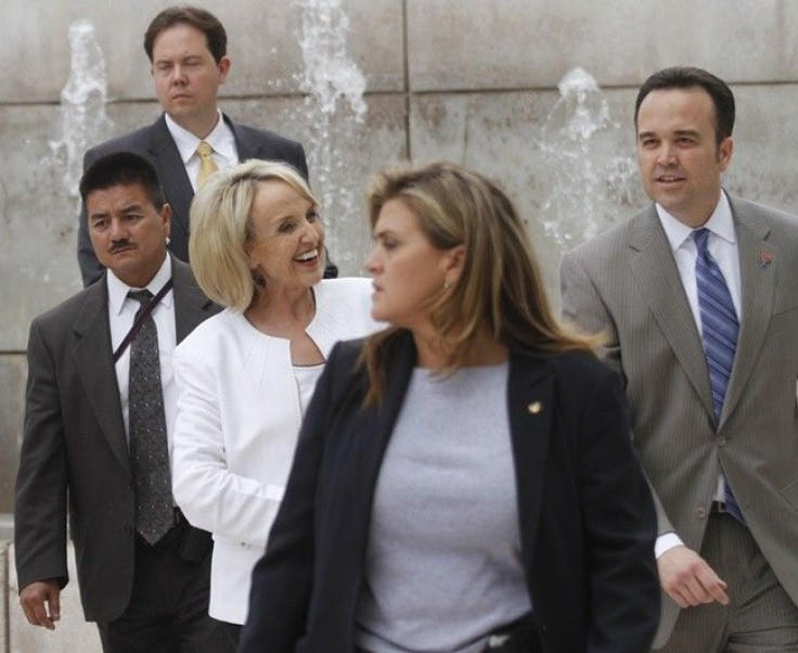Arizona's Governor Jan Brewer (C) leaves the U.S. District Court after her Senate Bill 1070 immigration law court hearing outside in Phoenix July 22, 2010. 