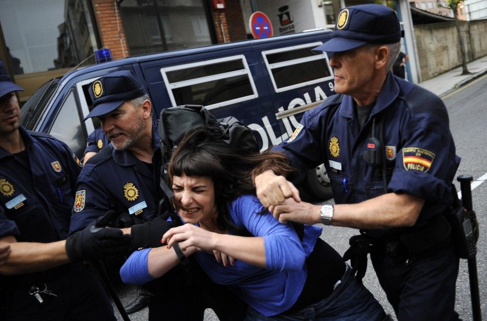 Stop Desahucios activists scuffle with police during a June 27 eviction in Oviedo, Spain