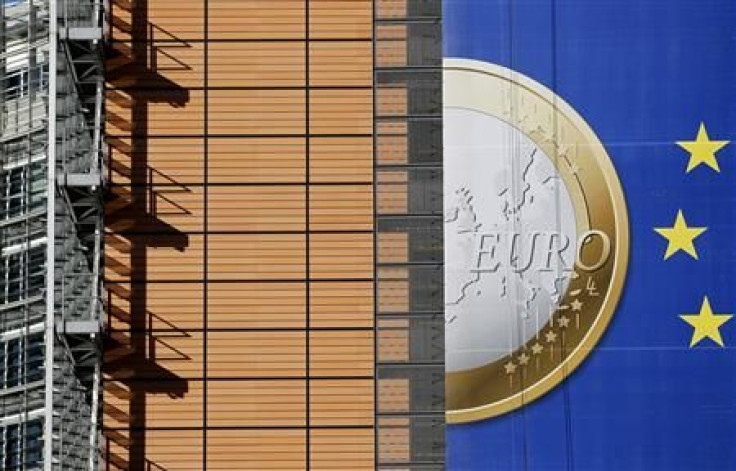 A banner showing a Euro coin is seen on the facade of the European Commission headquarters