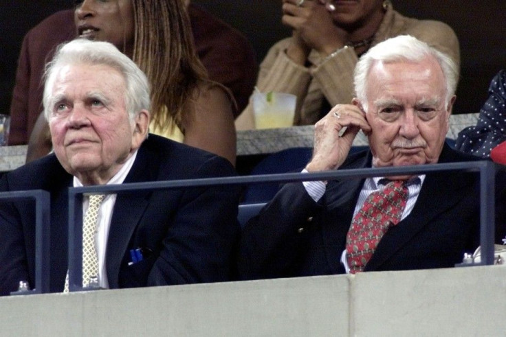 CBS legendary newsmen Andy Rooney (L) and Walter Cronkite watch the quaterfinal match between [Lleyt..