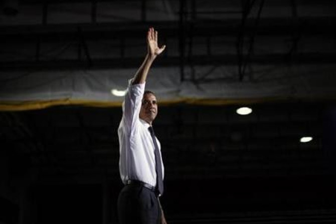 President Barack Obama waves on stage after delivering remarks on education at the University of Colorado in Denver