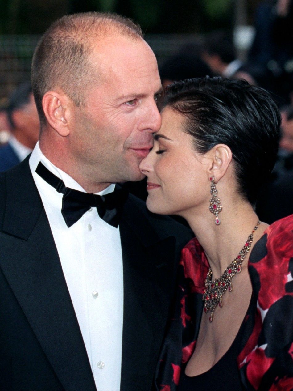 U.S. actor Bruce Willis and his wife U.S. actress Demi Moore arrive for the screening of quotle Cinqui..