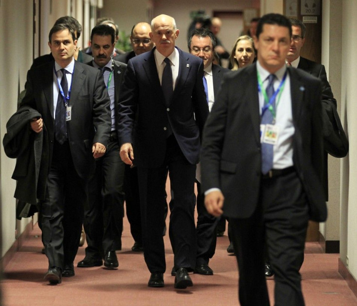 Greece's Prime Minister George Papandreou arrives at a news conference at the end of a euro zone summit in Brussels