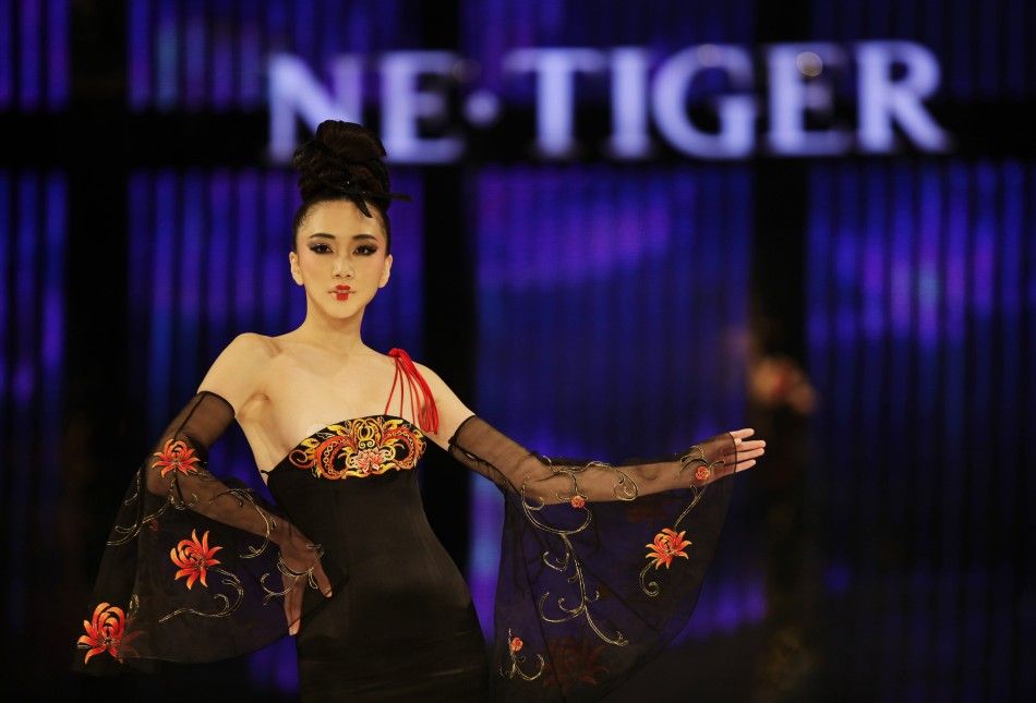 A model presents a creation for the NE TIGER 2012 Haute Couture collection with the theme quotTang Dynastyquot 618-907 during China Fashion Week for SpringSummer 2012 in Beijing, October 25, 2011.