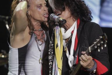 Steven Tyler (L) and Joe Perry of Aerosmith perform during a concert on the first stop of their Latin America tour at the Jockey Club in Asuncion 