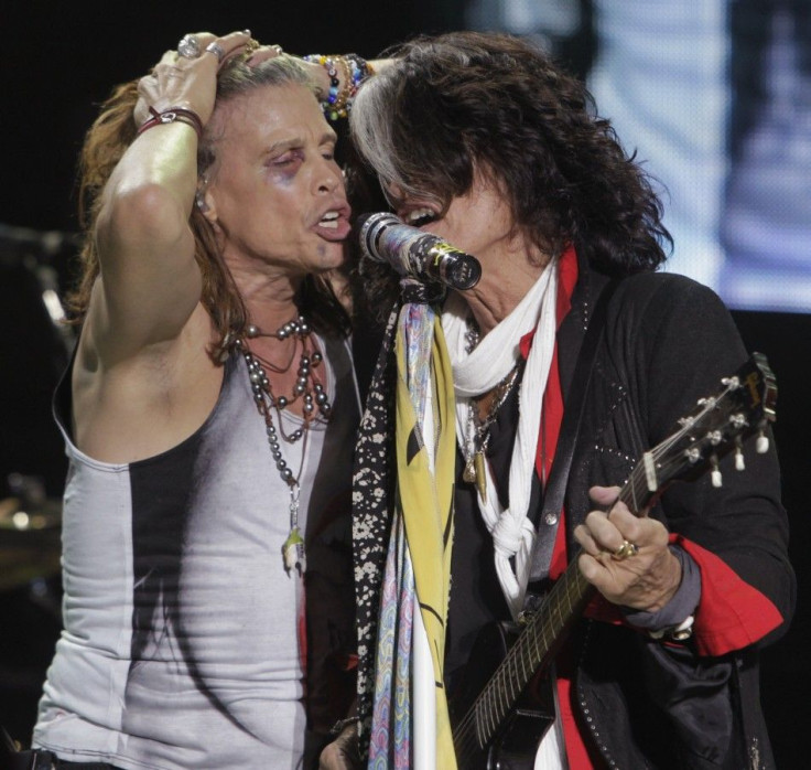 Steven Tyler (L) and Joe Perry of Aerosmith perform during a concert on the first stop of their Latin America tour at the Jockey Club in Asuncion 