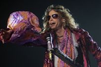 Steven Tyler, the lead singer of rock band Aerosmith, performs during a concert on the first stop of their Latin America tour at the Jockey Club in Asuncion