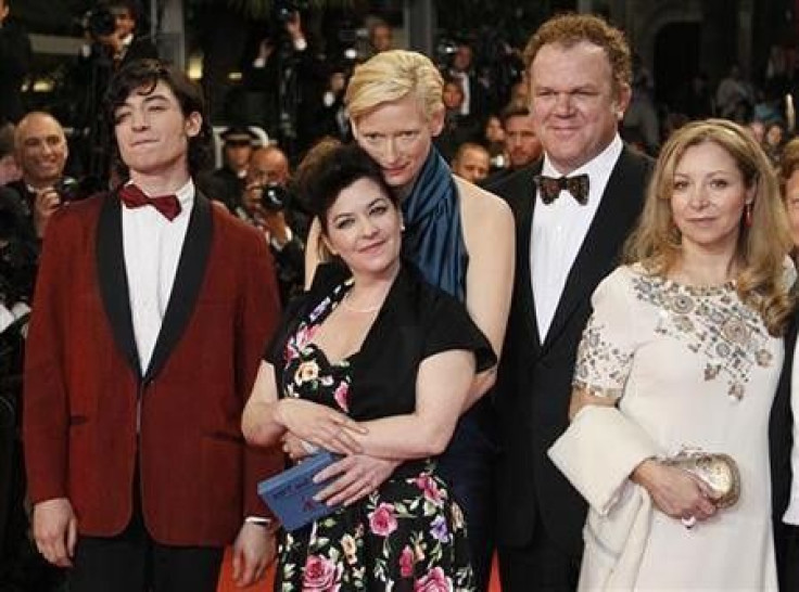 Director Lynne Ramsay (2nd,R) and cast members Ezra Miller (L), Tilda Swinton (3rd,L), John C. Reilly (2nd,R) pose with an unidentified guest as they arrive on the red carpet for the screening of the film &#039;&#039;We Need To Talk About Kevin&#039;&#039