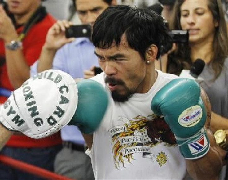 Congressman and boxer Manny Pacquiao of the Philippines trains during a media workout at Wild Card Boxing Club in Los Angeles October 26, 2011.