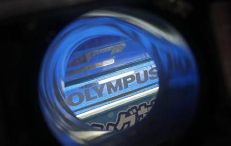Olympus&#039;s logo is seen through its waterproof housing at an electronics shop in Tokyo