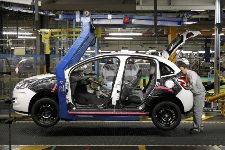 File picture of an employee working on the assembly line of the Citroen C3 at the PSA Peugeot Citroen plant in Poissy