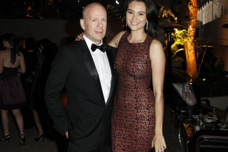 Actor Bruce Willis (L) and his wife Emma Heming pose at The Weinstein Company and Relativity Media&#039;s after party for the 68th annual Golden Globe Awards in Beverly Hills, California January 16, 2011.