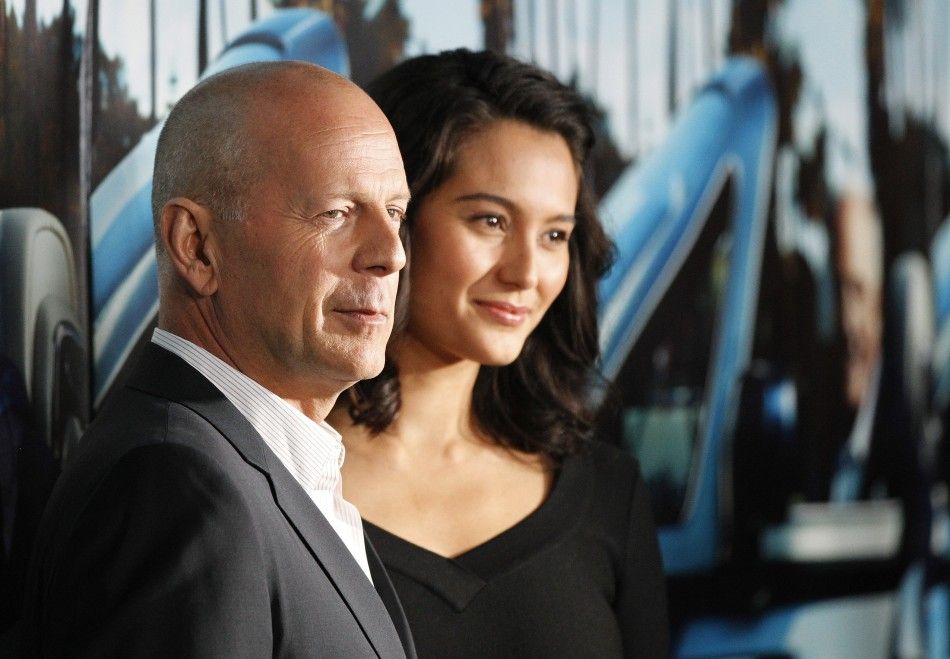 Actor Bruce Willis and his wife Emma Heming pose at the premiere of the HBO documentary quotHis Wayquot, which portrays the life of legendary movie producer Jerry Weintraub, at the Paramount theatre in Los Angeles March 22, 2011.