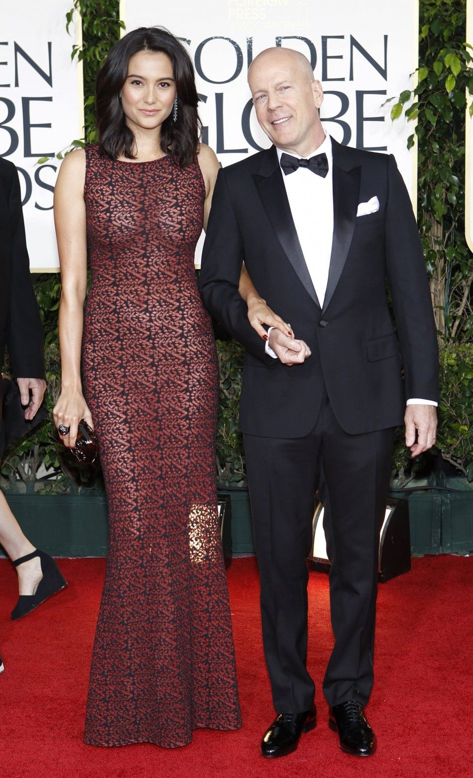 Actor Bruce Willis and his wife Emma Heming arrive at the 68th annual Golden Globe Awards in Beverly Hills, California, January 16, 2011.