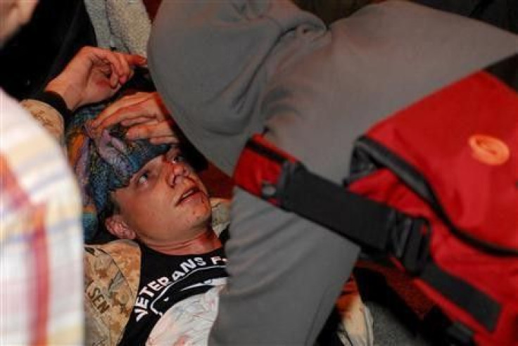 Occupy Oakland protester Scott Olsen, a former U.S. Marine and Iraq war veteran, lies on the street after being injured during a demonstration in Oakland, California