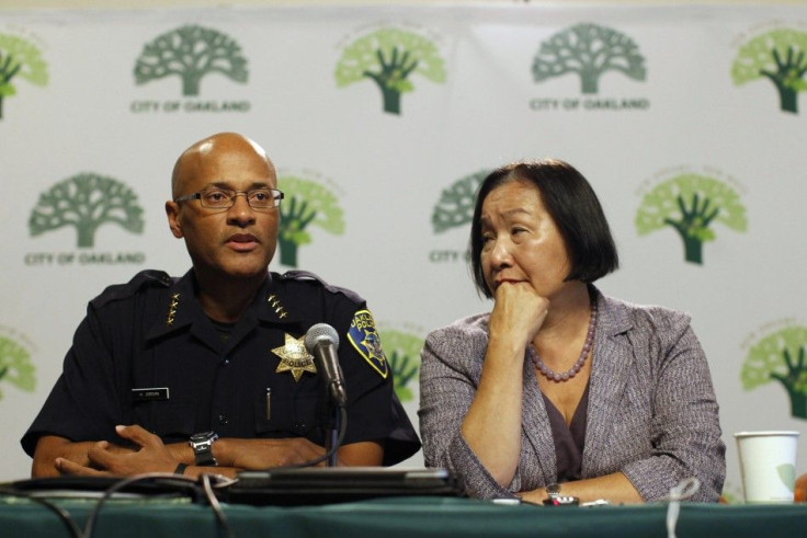 Oakland Mayor Jean Quan listens as Oakland Police Chief Howard Jordan speaks during a news conference at Oakland City Hall