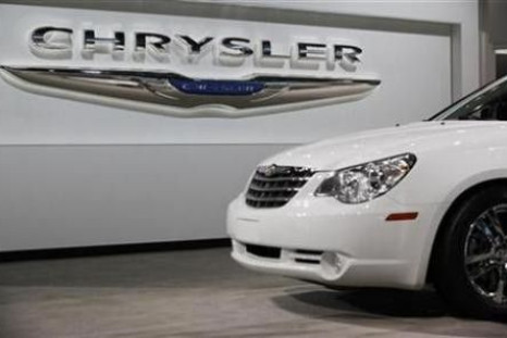 A Chrysler Sebring sits in front of the Chrysler logo at the New York International Auto Show in New York April 1, 2010. 