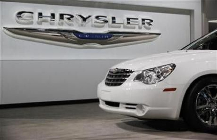 A Chrysler Sebring sits in front of the Chrysler logo at the New York International Auto Show in New York April 1, 2010. 