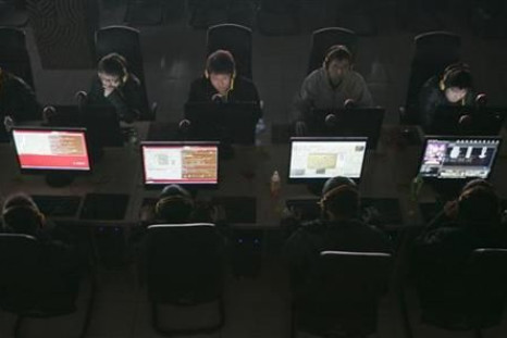 Customers use computers at an internet cafe in Taiyuan