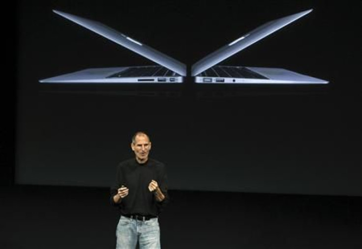 Apple CEO Steve Jobs unveils the company's latest high-end ultra-thin MacBook Air laptop models during a news conference at Apple Inc. headquarters in Cupertino