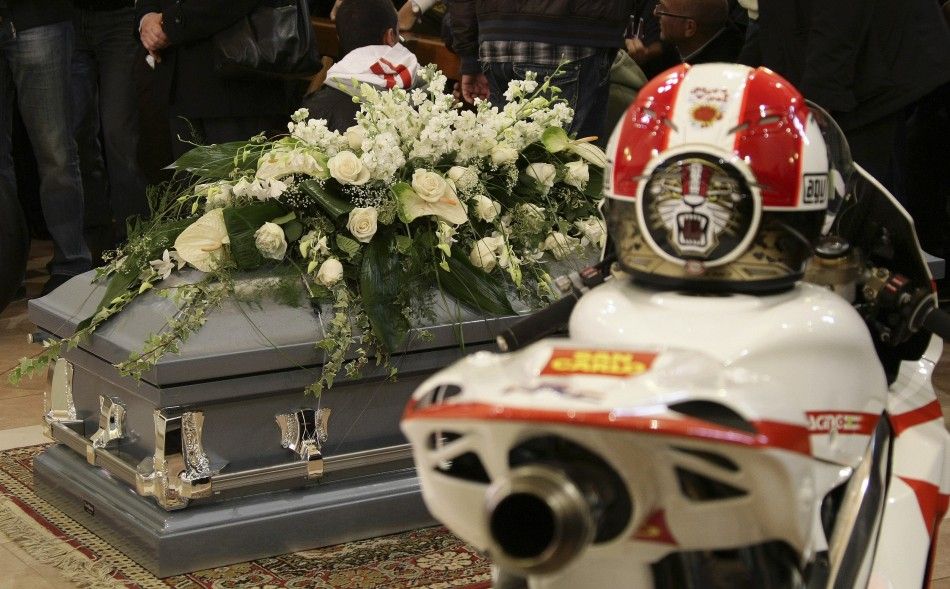 The coffin of Honda MotoGP rider Marco Simoncelli is seen during his funeral service at a church in Coriano