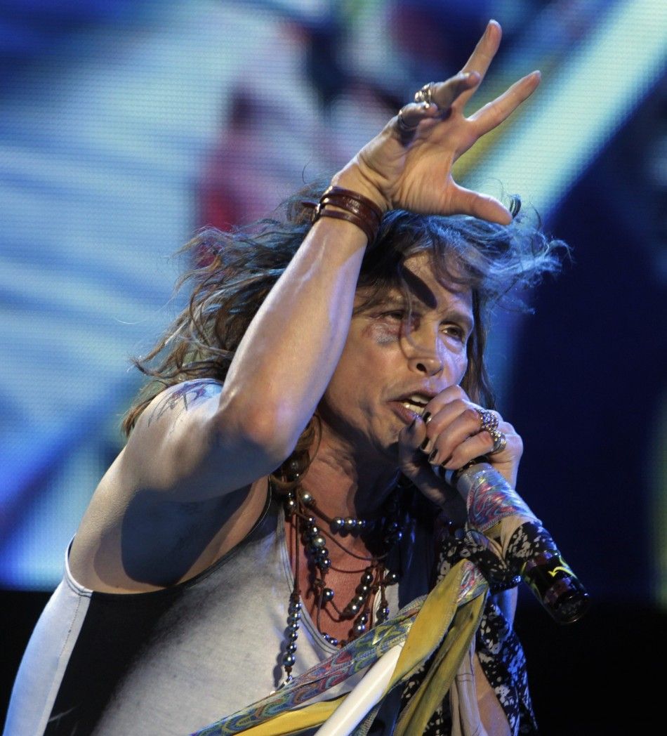 Steven Tyler of Aerosmith performs during a concert on the first stop of their Latin America tour at the Jockey Club in Asuncion October 26, 2011. Tyler, 63, had to be treated in a local hospital on Tuesday for injuries to his face and teeth after an acci