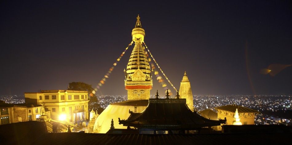 Kathmandu valley is seen against the illuminated Swyambhu Nath Stupa during the Tihar festival, October 26, 2011.