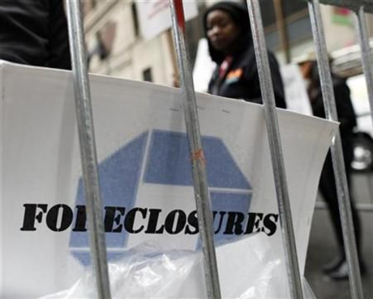 A demonstrator&#039;s sign is seen outside the JPMorgan Chase annual shareholders meeting in New York&#039;s financial district