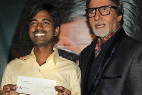 Real-life 'Slumdog Millionaire' Sushil Kumar (left), with Bollywood actor Amitabh Bachchan, shows $1 million check after winning on India's version of 'Who Wants to Be a Millionaire.'  Read more: http://www.nydailynews.com/news/wo