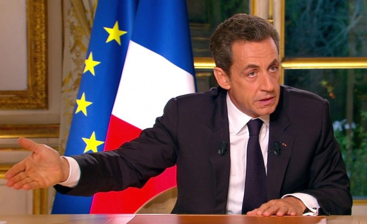 France's President Sarkozy, seen in this video grab from TF1 French television in a prime time interview from the Elysee Palace in Paris, speaks to the nation about the eurozone economy