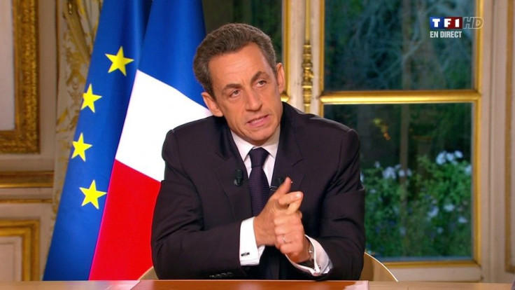 France's President Sarkozy, seen in this video grab from TF1 French television in a prime time interview from the Elysee Palace in Paris, speaks to the nation about the eurozone economy