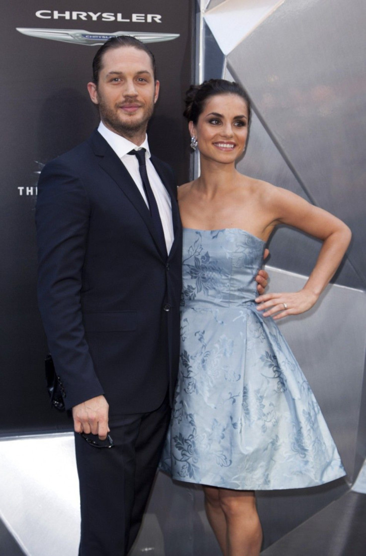 Cast member Tom Hardy and his fiancee attend the world premiere of the movie &quot;The Dark Knight Rises&quot; in New York