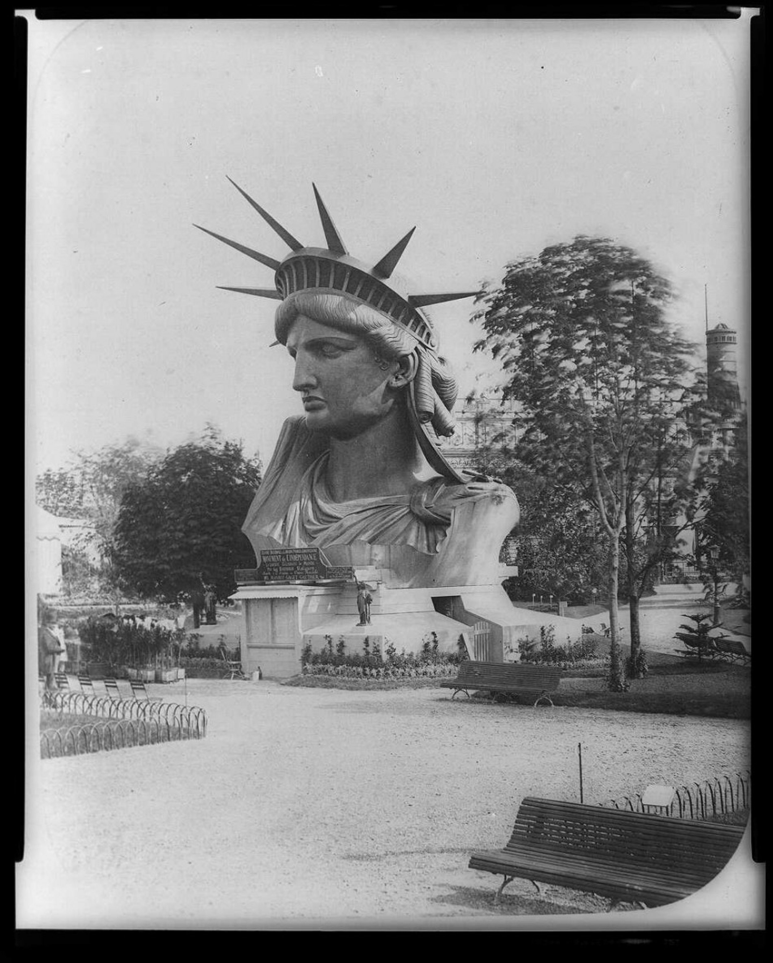 Head of Statue of Liberty on display in Paris park.