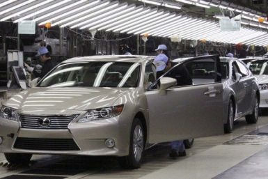 Toyota workers inspect the new Lexus ES vehicles at a Toyota plant in Miyawaka