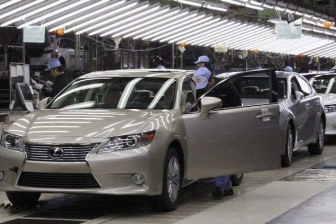 Toyota workers inspect the new Lexus ES vehicles at a Toyota plant in Miyawaka
