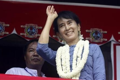 Suu Kyi, leader of Myanmar's democratic opposition, waves during the opening ceremony of Aungsan Jar-mon Library at Thanatpin township near Bago