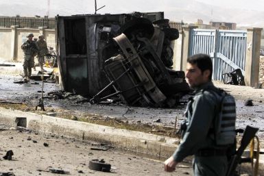 Foreign and Afghan forces arrive at the site of a suicide attack in Kabul