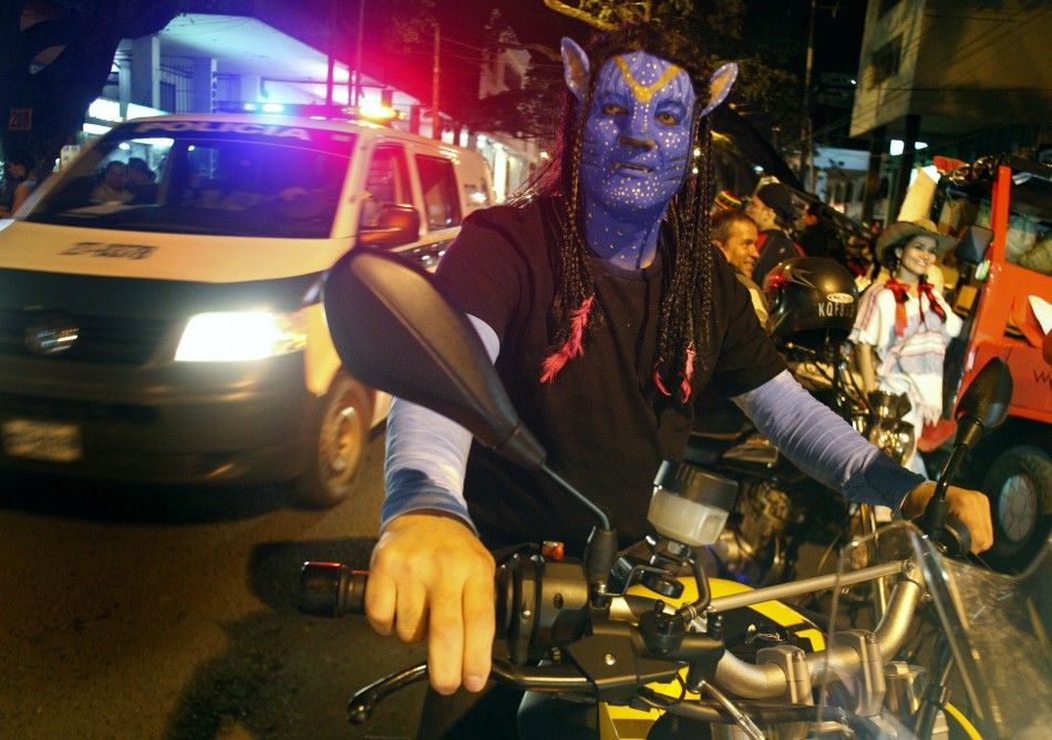 A man dressed as a character from the movie Avatar takes part in the quotMoto Halloween Party 2010quot in Cali